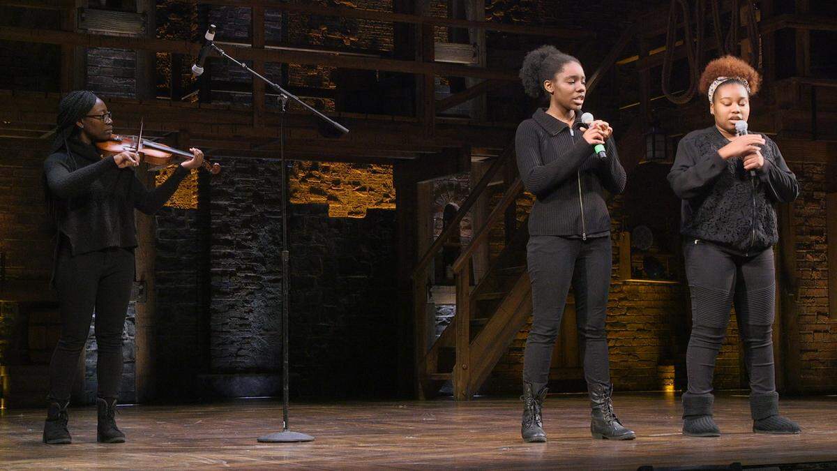 West Charlotte High School seniors Kaycee Hailey, Shazaria Hoover and Kaliyah Landrum (l-r) performed a piece on Sally Hemings on the stage where Charlotte’s “Hamilton” musical took place as part of the EduHam initiative.