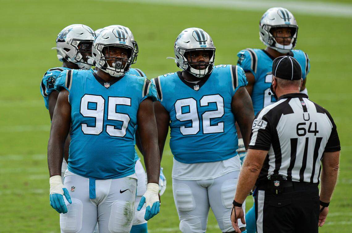 Rookie Carolina Panther defensive tackles Derrick Brown (95), with teammmate Zach Kerr (92), had a critical penalty Sunday that set up a Tampa Bay touchdown.