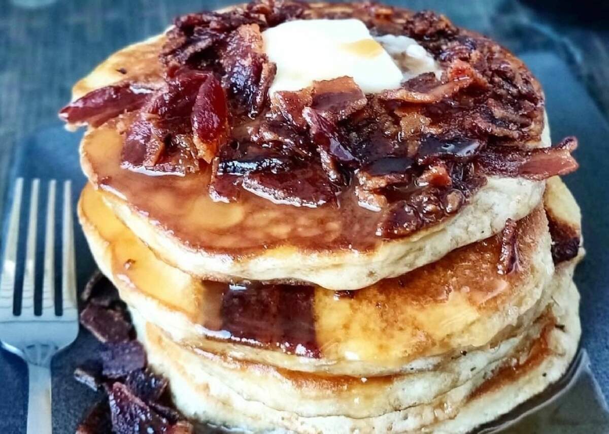 The maple bourbon bacon pancakes are topped with bourbon-infused syrup.