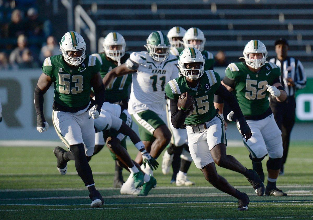 Charlotte quarterback, #15, Deshawn Purdie, ramble for a first half gain against UAB. Following a win last week against Florida Atlantic under interim coach, Tim Brewster, the Charlotte 49ers football team wrapped up their season on Senior Day at home against the UAB Blazers on Saturday, Nov. 30, 2024. Charlotte trailed UAB 14-13