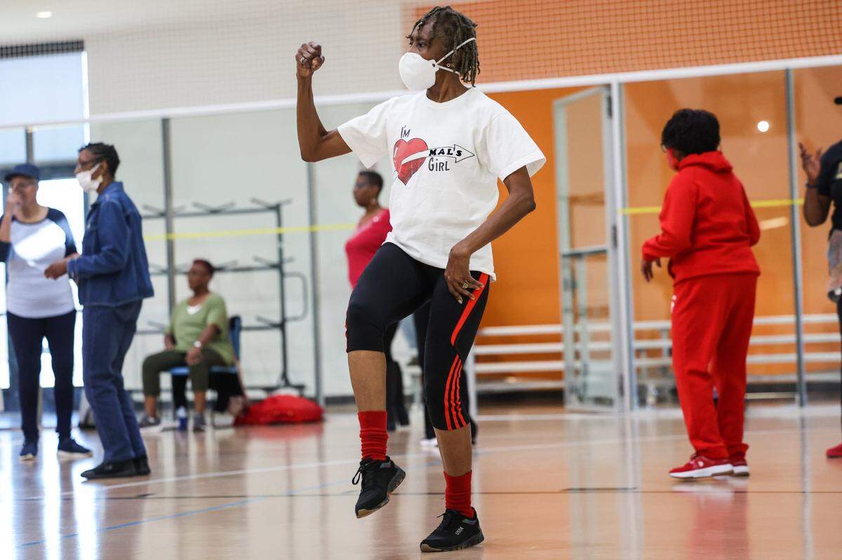 Deb Folder, center, pumps her fist while practicing moves during the Valentines Day Line Dance Social for seniors at Castaway Regional Recreation Center on Tuesday, February 14, 2023.