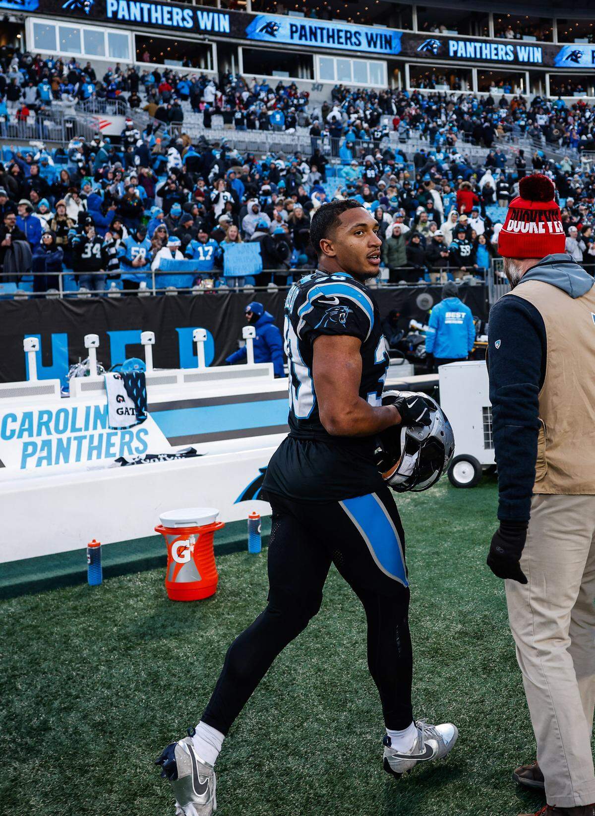 Panthers runningback Chuba Hubbard runs along the sideline after scoring the game winning touchdown in overtime agains tthe Cardinals for a final score of 36-30 at Bank of America Stadium in Charlotte, NC on Sunday, December 22, 2024.