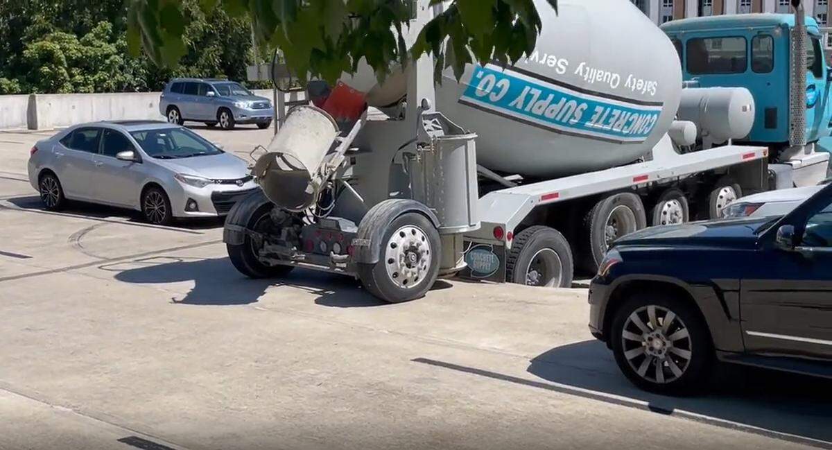 A concrete mixing truck partially collapsed the top of a parking deck in the 500 block of East Morehead Street on Wednesday afternoon, Sept. 14, 2022, the Charlotte Fire Department reported on Twitter.