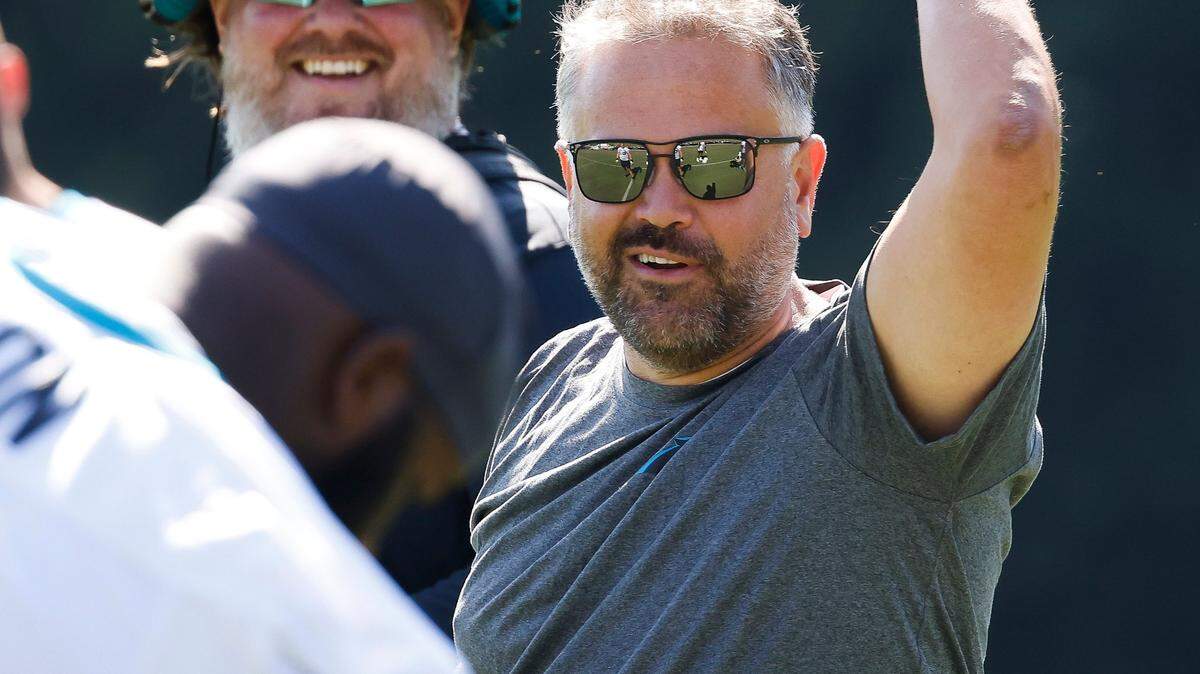 Carolina Panthers head coach Matt Rhule jokes with players during the teams training camp practice at Wofford College in Spartanburg, S.C., Thursday, July 28, 2022.