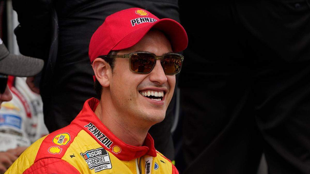 Joey Logano smiles before a NASCAR Cup Series auto race at the Michigan International Speedway in Brooklyn, Mich., Sunday, Aug. 7, 2022. (AP Photo/Paul Sancya)