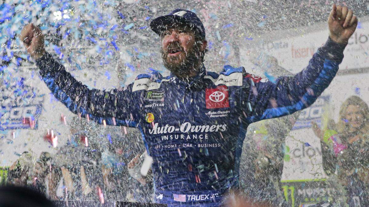 Martin Truex Jr., celebrates after winning at Martinsville on Sunday.