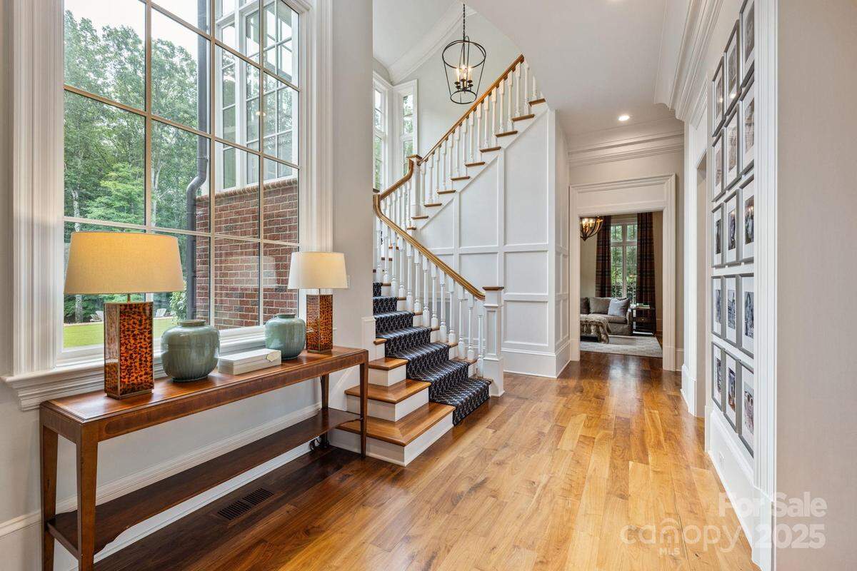 A winding staircase leads to the upper level of the mansion.
