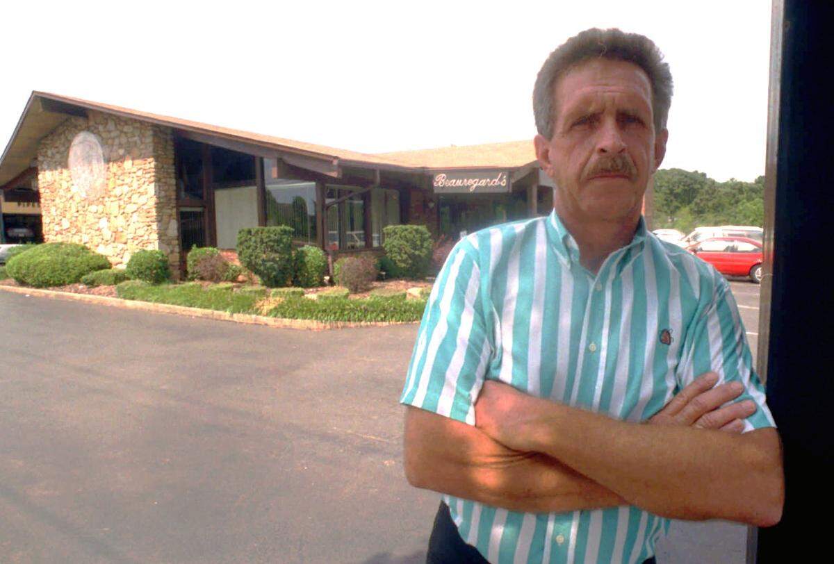 Joe Clark, former owner of Beauregard’s Restaurant on Freedom Drive, shown in 1993 in front of the restaurant.