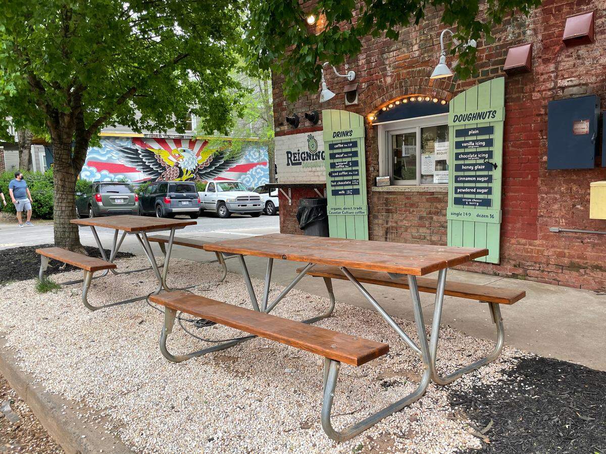 Picnic tables sit outside Reigning Doughnuts in NoDa.