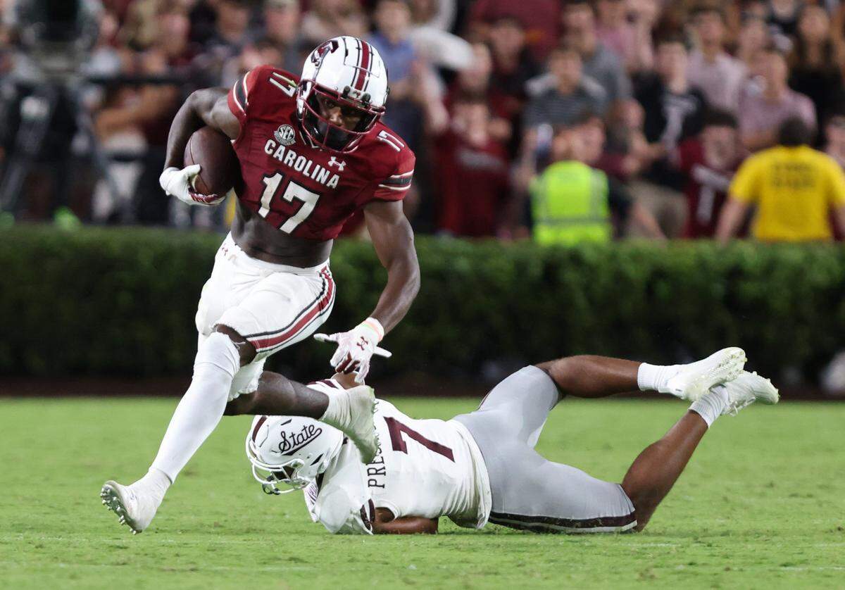 South Carolina wide receiver Xavier Legette (17) dodges the tackle of Mississippi State safety Shawn Preston Jr. in 2023.