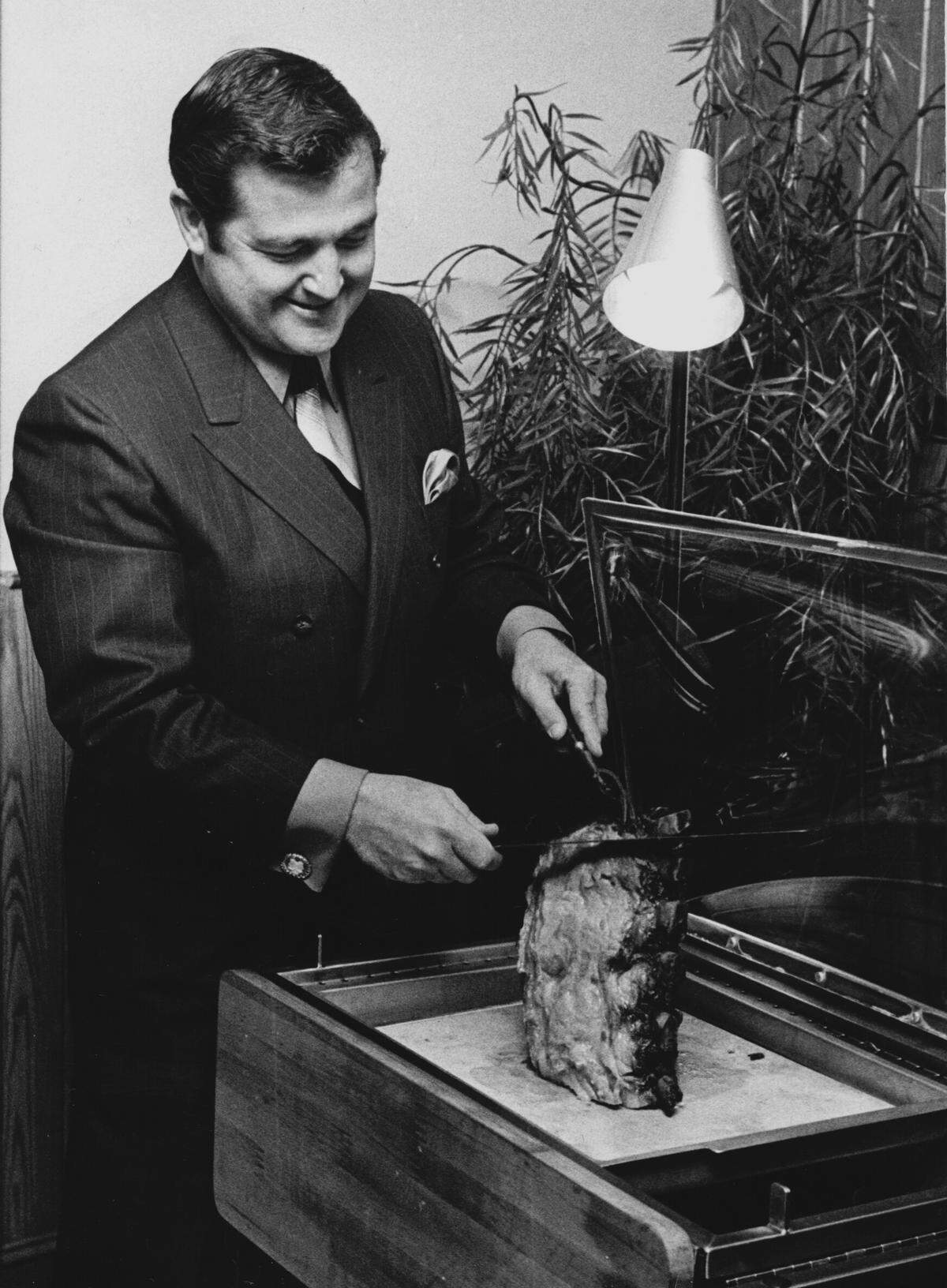 In this May 1, 1970 photo, James "Slug" Claiborne sliced prime rib of beef at his new restaurant, Slug's Rib, on Independence Boulevard. The meat was wheeled to the table on a cart and carved to order.
