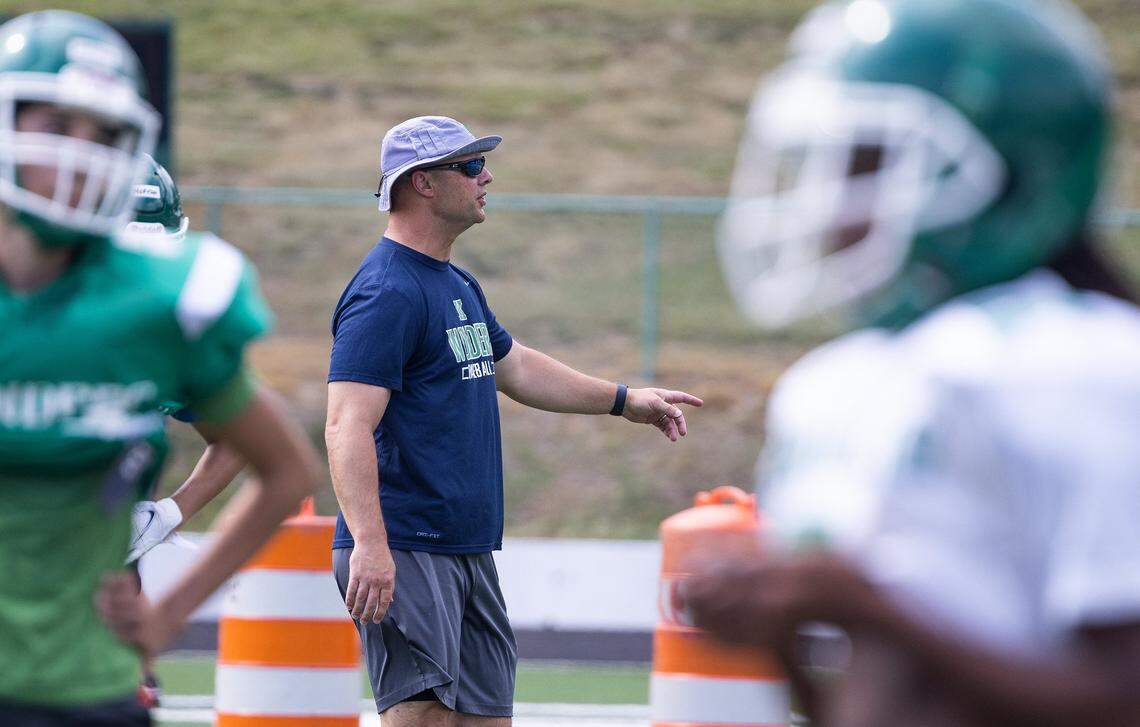 Mike Morton, dentist and former NFL player, helps coach football at A.L. Brown High School in Kannapolis, N.C., on Tuesday, May 19, 2022. Mike Morton will make his referee debut this fall in the NFL.
