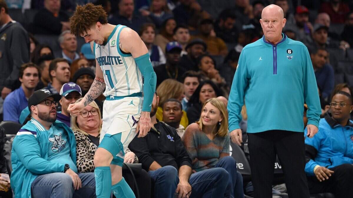 Charlotte Hornets guard LaMelo Ball, left, gingerly walks to the team’s bench after injuring his left ankle during late fourth quarter action against the Indiana Pacers at Spectrum Center in Charlotte, NC on Wednesday, November 16, 2022. Ball sat down on the bench momentarily before limping to the team’s locker room prior to the end of the game. The Pacers defeated the Hornets 125-113.