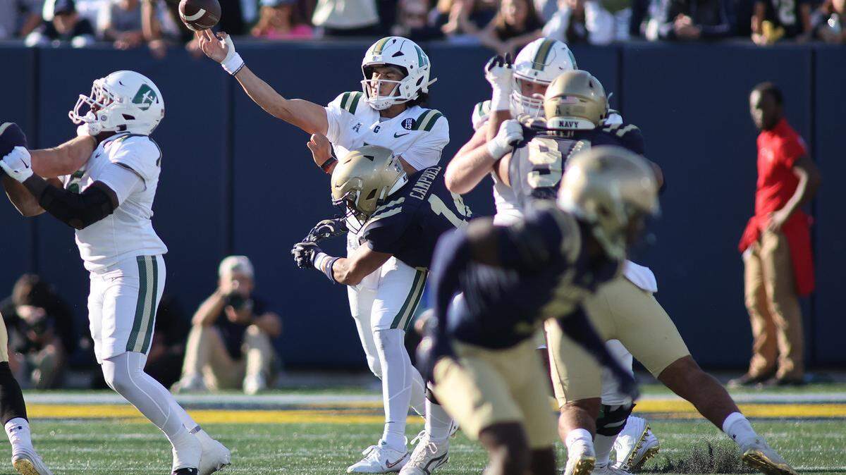 Navy Midshipmen safety Jaxson Campbell (14) hits Charlotte 49ers quarterback Max Brown (1) during the Oct. 19 game at Navy-Marine Corps Memorial Stadium. Daniel Kucin Jr.-Imagn Images
