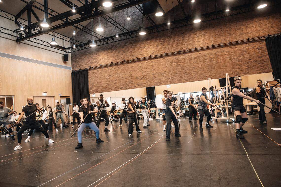 The cast of “The Hunger Games: On Stage” in rehearsal. The show is currently in previews at the new Troubadour Canary Wharf Theatre in London.