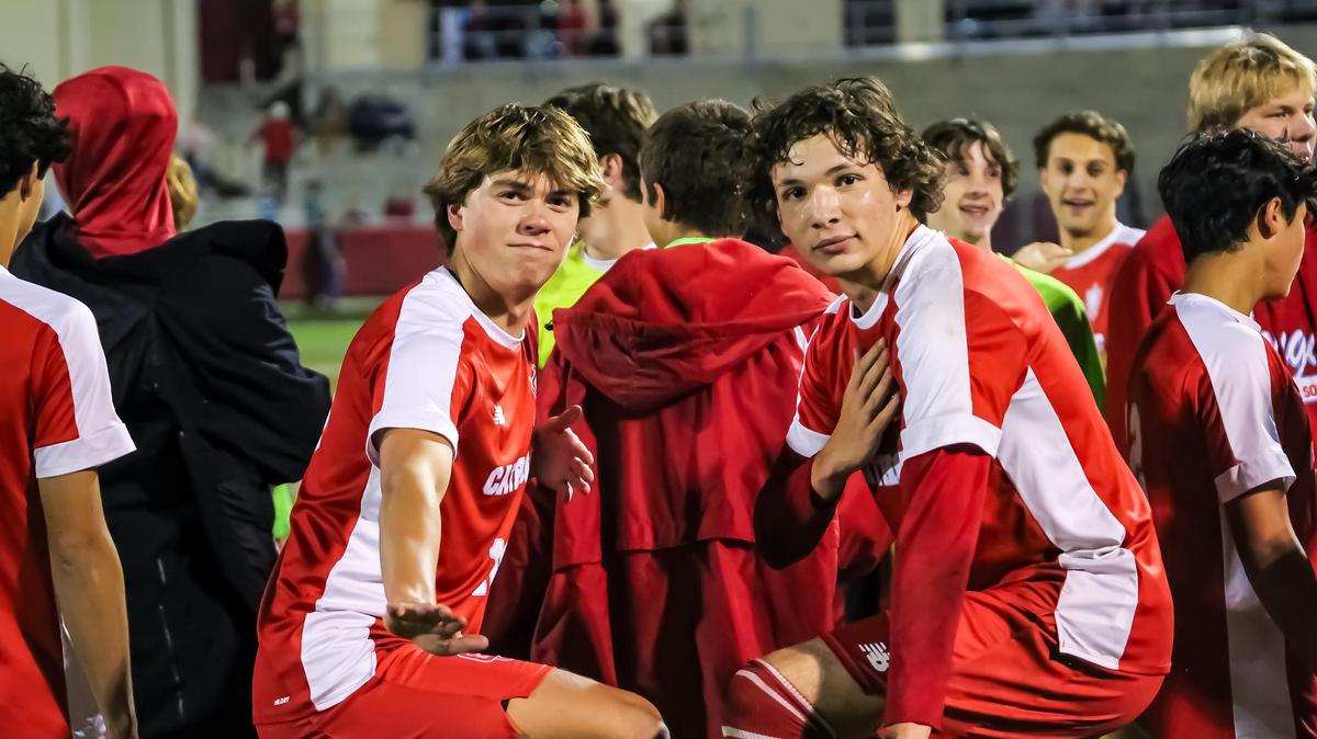 Charlotte Catholic celebrates their 2-1 win over South Meck at the NCHSAA soccer quarterfinals at Charlotte Catholic on November 16th in Charlotte NC