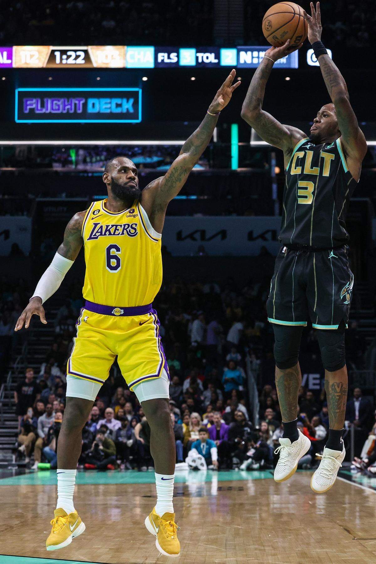 Hornets guard Terry Rozier, right, shoots over Lakers guard LeBron James during the game at Spectrum Center on Monday, January 2, 2023. Rozier scored 27 points, including 17 in the fourth quarter, but James trumped that with 43 points in the Lakers’ 121-115 win.