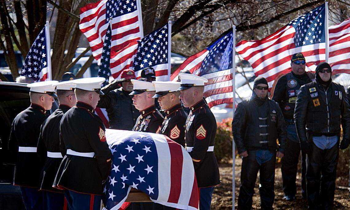 The flag-draped casket carrying the body of Gunnery Sgt. Chris Eckard arrives at Highland Baptist Church for his memorial service. “I didn’t want him to keep re-enlisting," his mother, Eunice Eckard, says, "and he says, ‘Well, Mama, what better way to die than to die for your country?’"