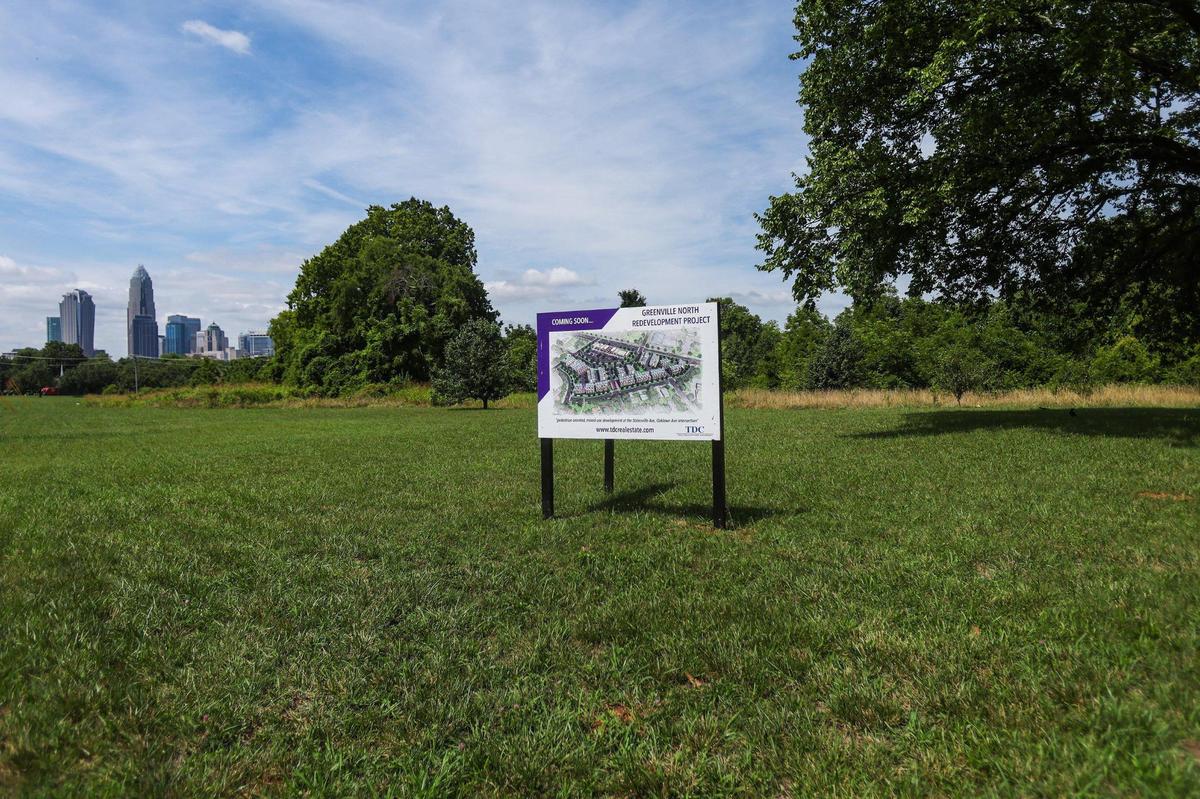 A sign announcing the development of a new residential project in the Greenville neighborhood is seen along Statesville Avenue. The site is not far from the 76-acre Camp North End project, the popular redevelopment of older industrial-type buildings.