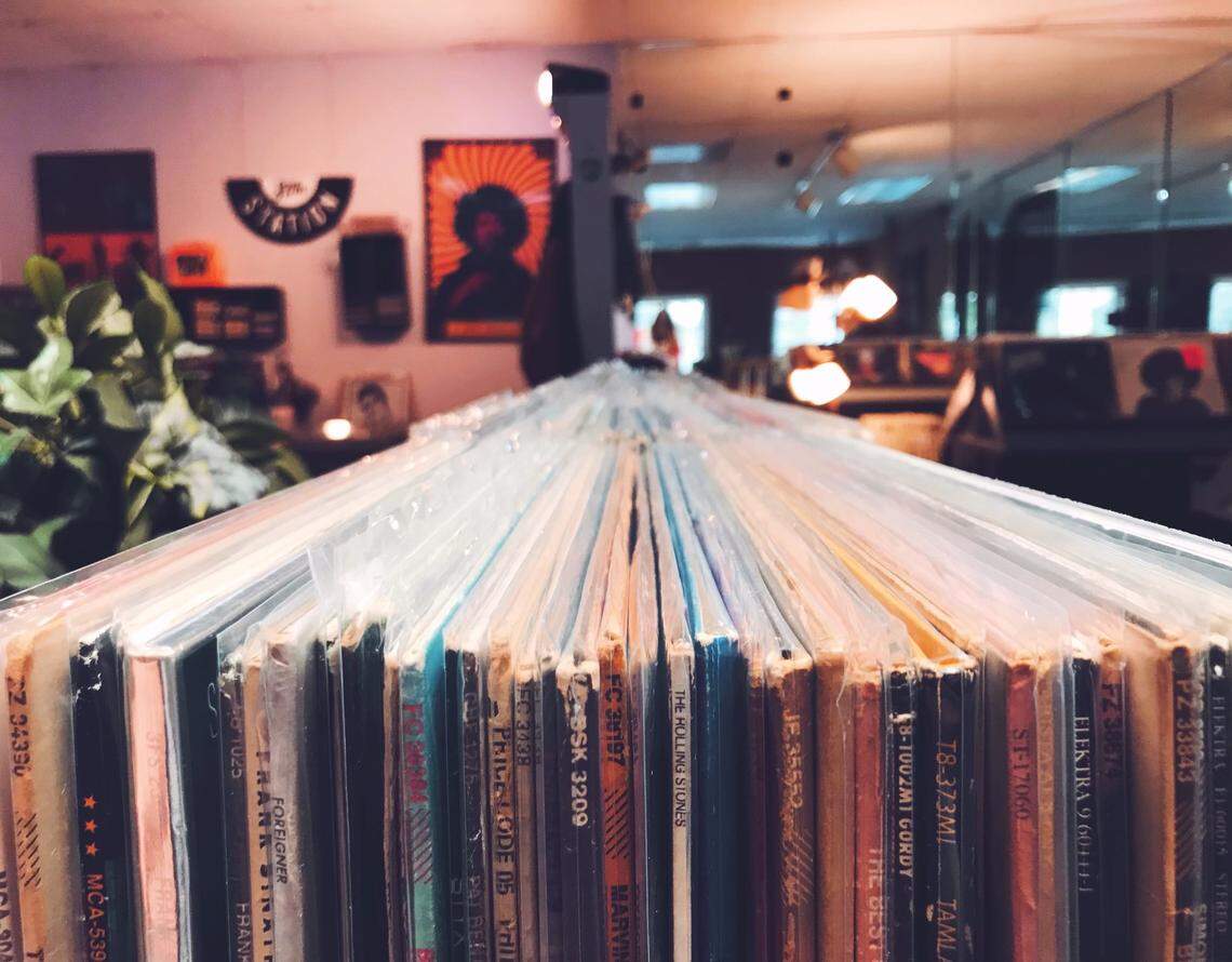 Records stacked at Hardy Boys Records and Comics shop.