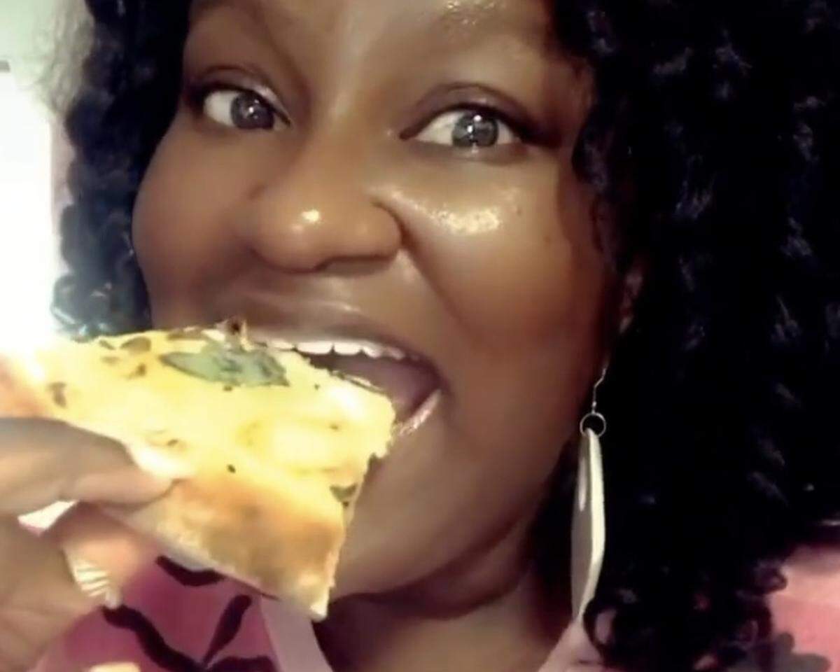April Blanding tries the seafood pizza — topped with shrimp, clams, calamari, Grana Padano, cracked black pepper, basil and red pepper — from Millstone Pizza and Taphouse in Rock Hill, SC, for the first time.