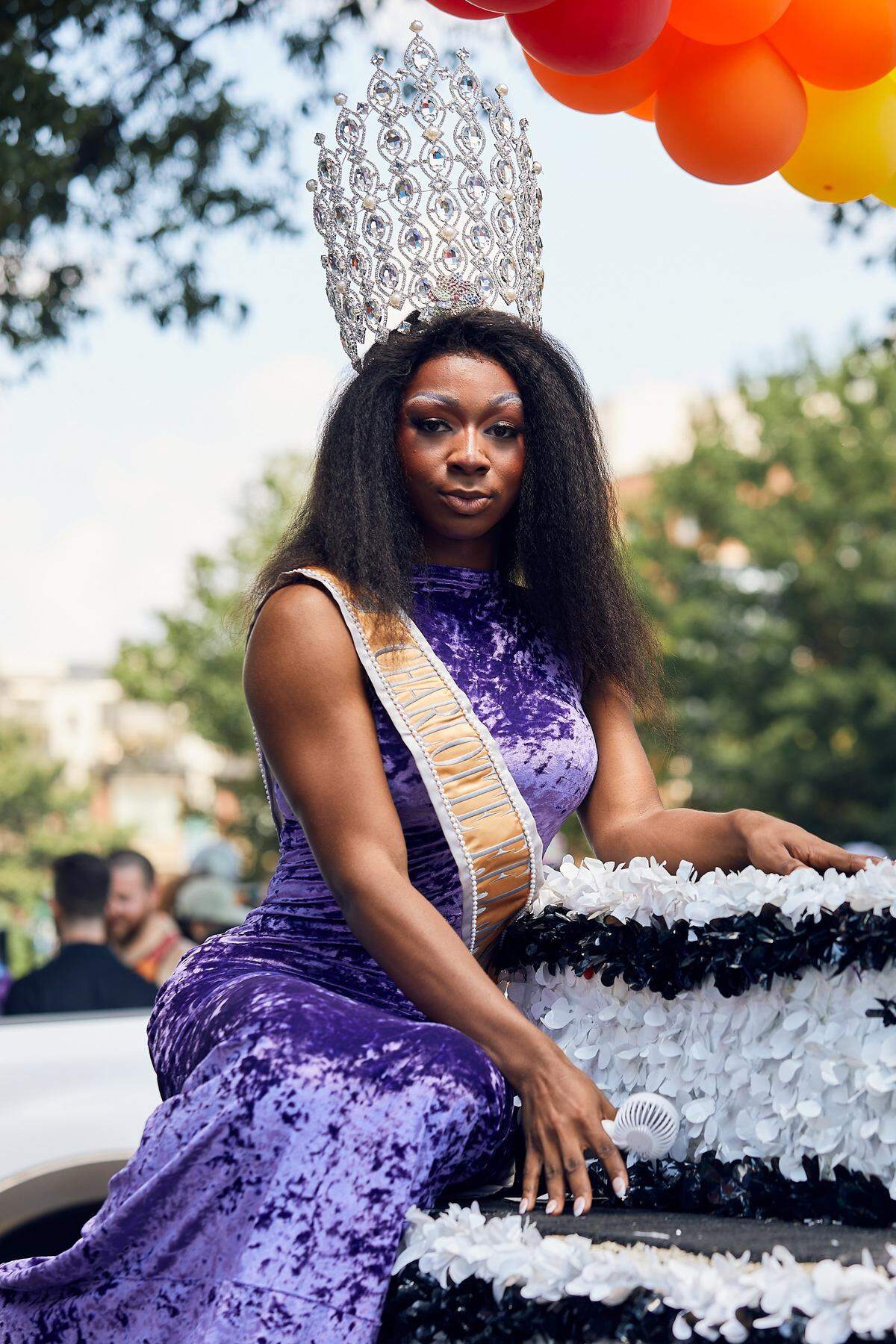 The Charlotte Black Pride Jr. Miss poses on the Charlotte Black Pride float prior to the 25th Charlotte Pride Parade in uptown Charlotte on August 17, 2025.