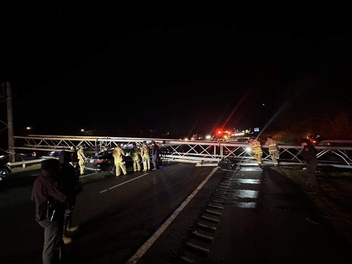 NCDOT interstate maintenance crew members are shown at the scene of a sign collapse near the Arrowood Road exit on Interstate 77 South in Charlotte on Saturday, Nov. 29, 2025.