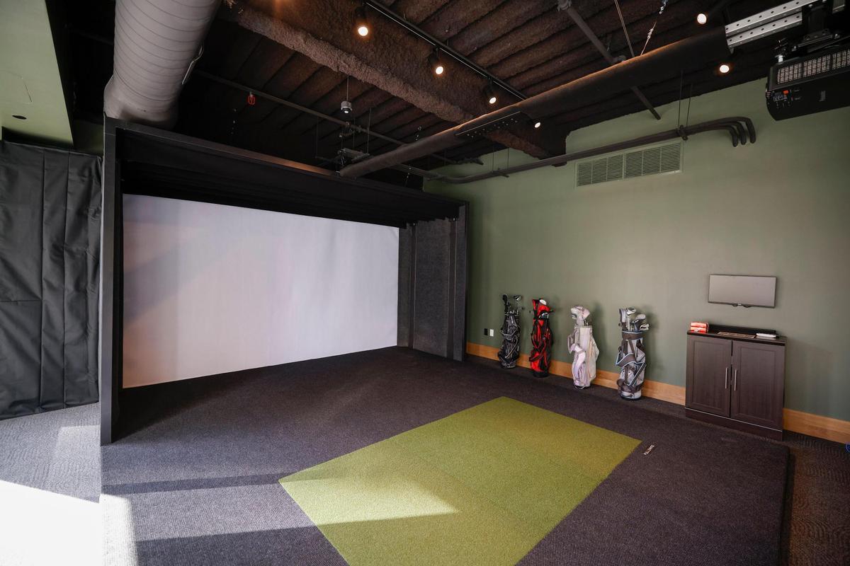 A golf simulator on the third floor at One South will give employees a place to blow off some steam.