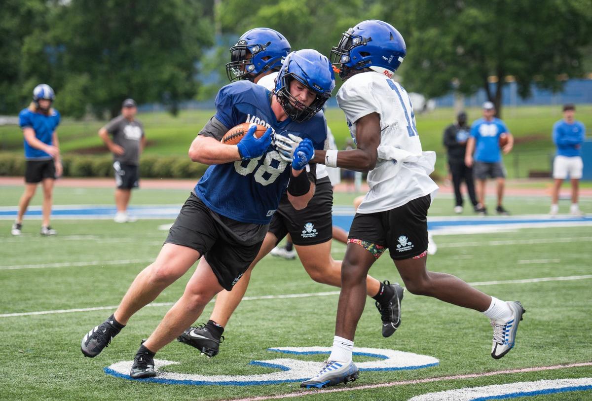 Mooresville High players practice drills at Coach Joe Popp Stadium on July 25, 2024.