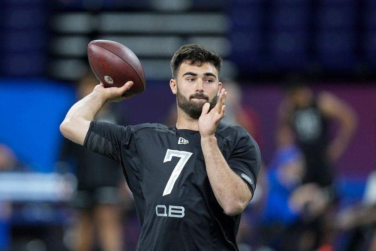 North Carolina quarterback Sam Howell runs a drill during the NFL football scouting combine, Thursday, March 3, 2022, in Indianapolis. (AP Photo/Darron Cummings)