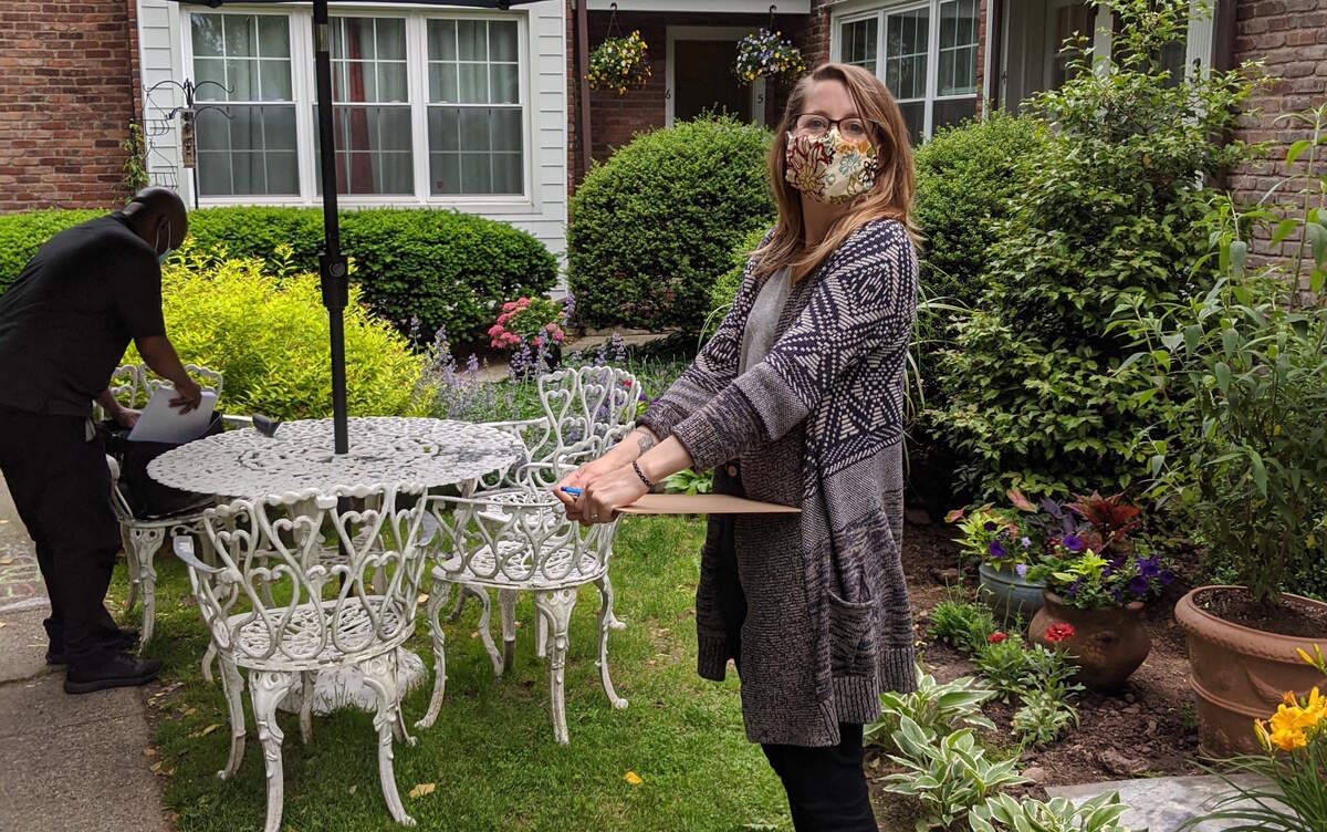 Marilyn Glinka and her husband, Michael Wilson, wore masks and met with a notary outdoors in New Jersey to close on their new Charlotte home.