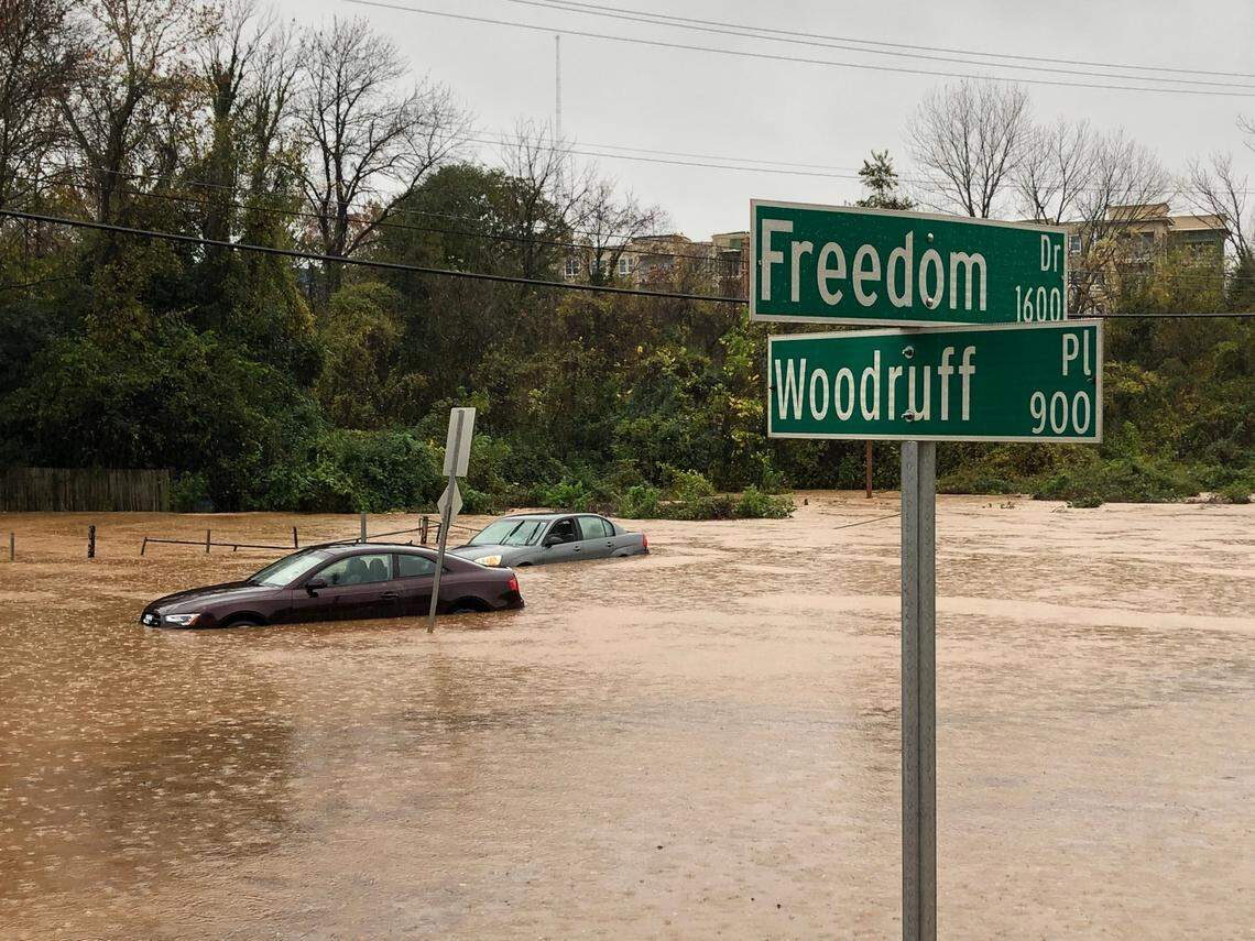 Two cars sit under water at the intersection of Freedom Dr. and Woodruff Place in Charlotte, NC following heavy rains on Thursday, November 12, 2020.