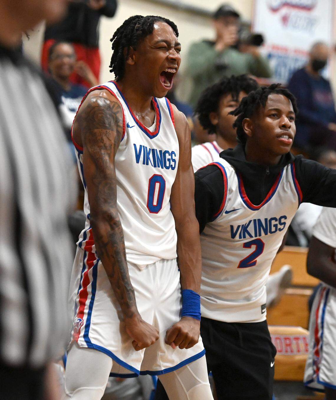North Meck’s Isaiah Evans flexes as he celebrates his teammates play against Mallard Creek on Friday, February 2, 2024 at North Meck High. North Meck defeated Mallard Creek 108-64.