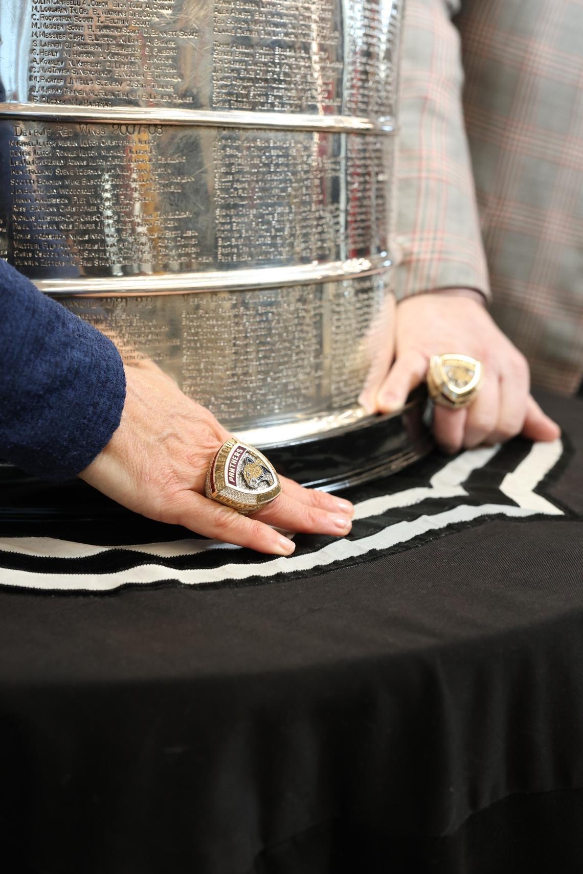 Tera Black, Chief Operating Officer of the Charlotte Checkers, pose with the Stanley Cup. She and ownership partner Michael Kahn each received championship rings from the Florida Panthers, the reigning Stanley Cup champions.