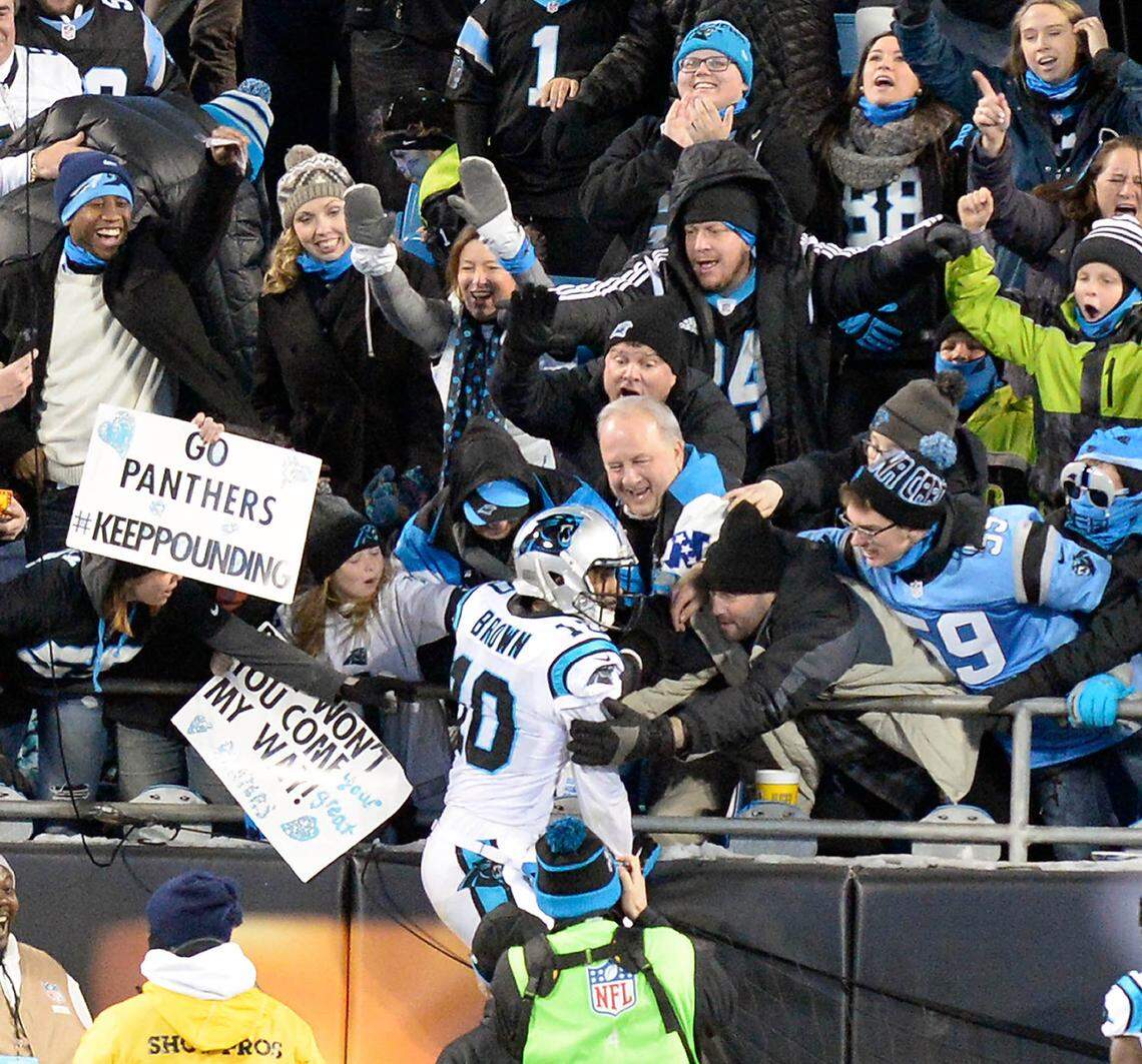 Carolina Panthers wide receiver Corey Brown (10) celebrates his 86-yard touchdown pass from Cam Newton against the Arizona Cardinals by jumping in the stands in the first quarter of the NFC Championship game at Bank of America Stadium on Jan. 24, 2016. Carolina won, 49-15, advancing to Super Bowl 50 against the Denver Broncos.