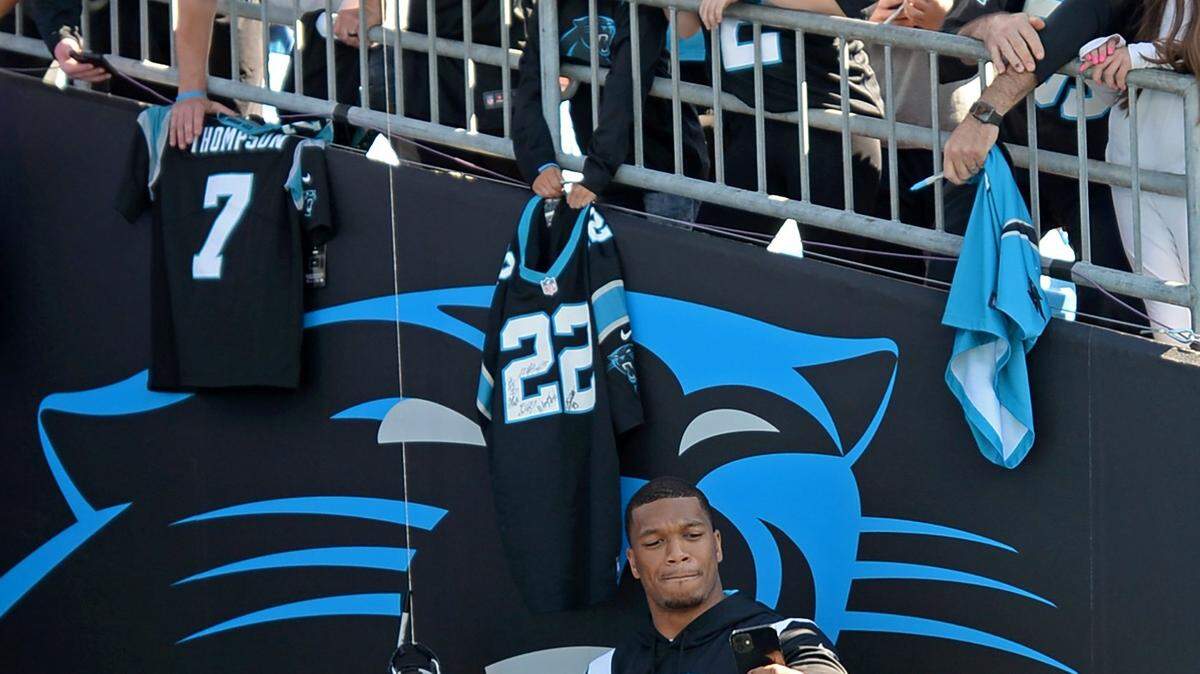 Carolina Panthers wide receiver DJ Moore takes a selfie with fans prior to the team’s game against the Tampa Bay Buccaneers on Sunday, October 23, 2022.