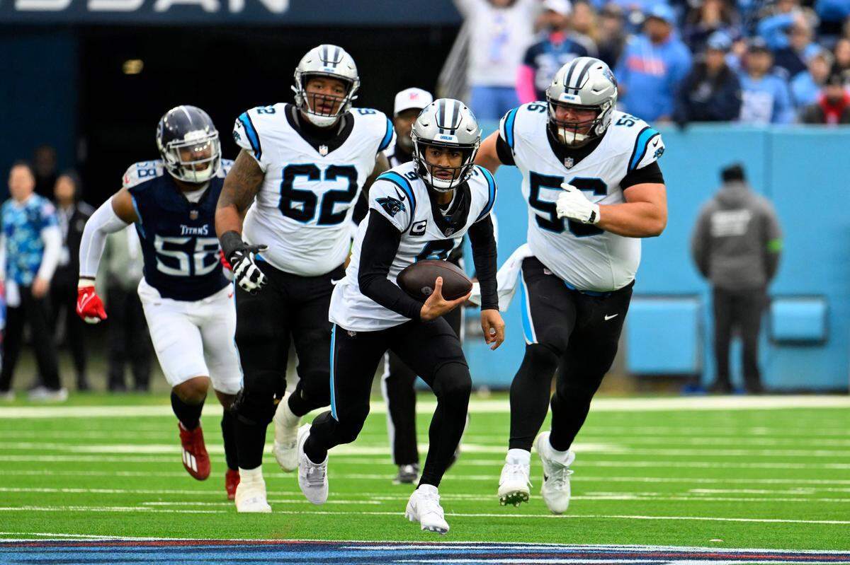 Carolina Panthers quarterback Bryce Young (9) scrambles against the Tennessee Titans during the first half of an NFL football game Sunday, Nov. 26, 2023, in Nashville, Tenn. (AP Photo/John Amis)