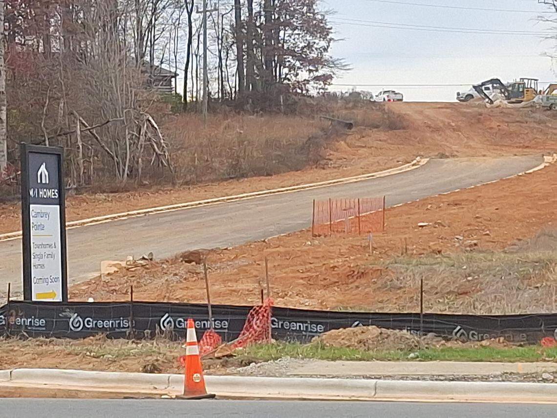 An entrance road to Cambrey Pointe has been carved from N.C. 150, near where Rinehardt Road intersects with a congested four-lane stretch of the highway. Plastic road markers blocked the entrance on Nov. 13.