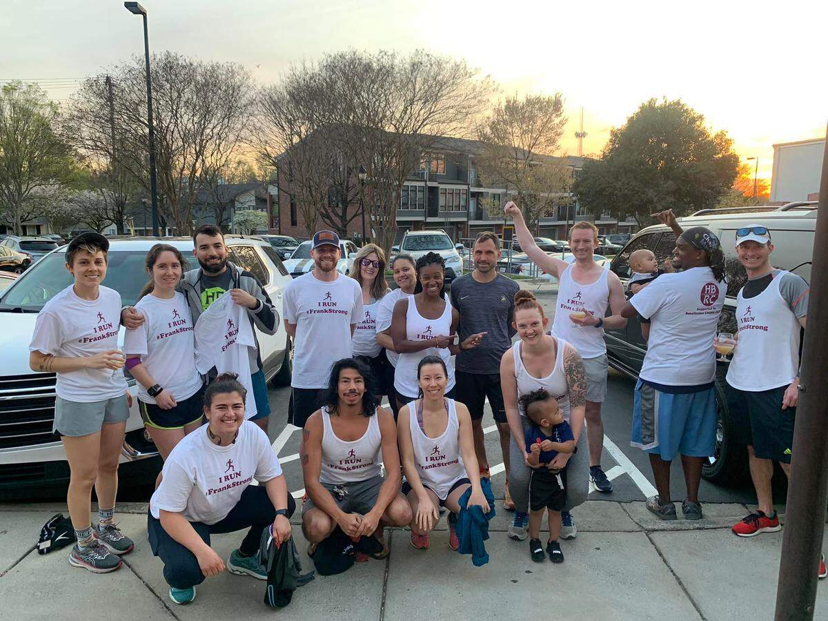 Members of the Heist Brewery Run Club in NoDa surprised Frank Turner early last month by all wearing #FrankStrong T-shirts in support of his battle against brain cancer.