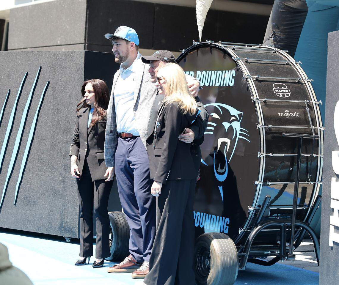 Monroe Freeling, second from left, poses with Carolina Panthers executives on Friday at Bank of America Stadium.