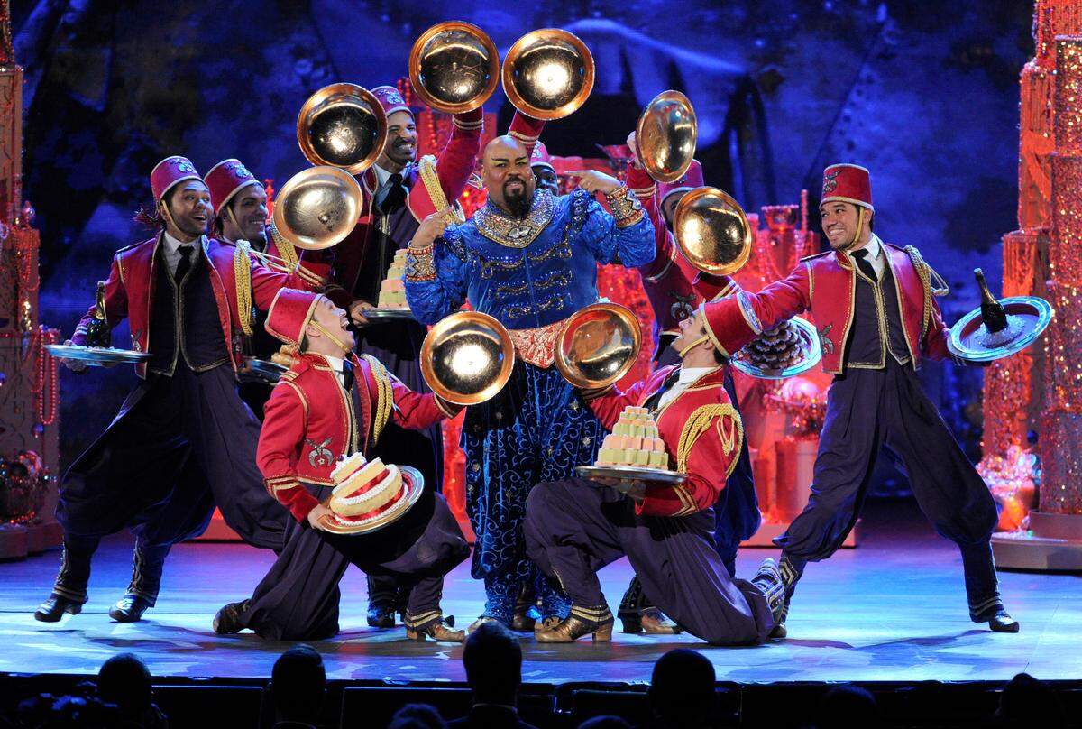 James Monroe Iglehart, center, as the genie, and the cast of “Aladdin” perform at the Tony Awards in New York in 2014. The touring company is coming to Charlotte in September.