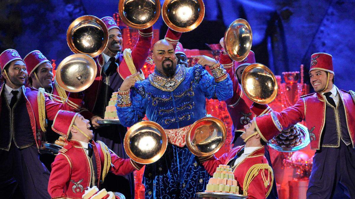 James Monroe Iglehart, center, as the genie, and the cast of “Aladdin” perform at the Tony Awards in New York in 2014. The touring company is coming to Durham.