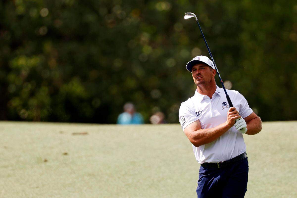 Bryson DeChambeau plays from the fairway Saturday on the fifth green during the third round of the Masters Tournament at Augusta National Golf Club.