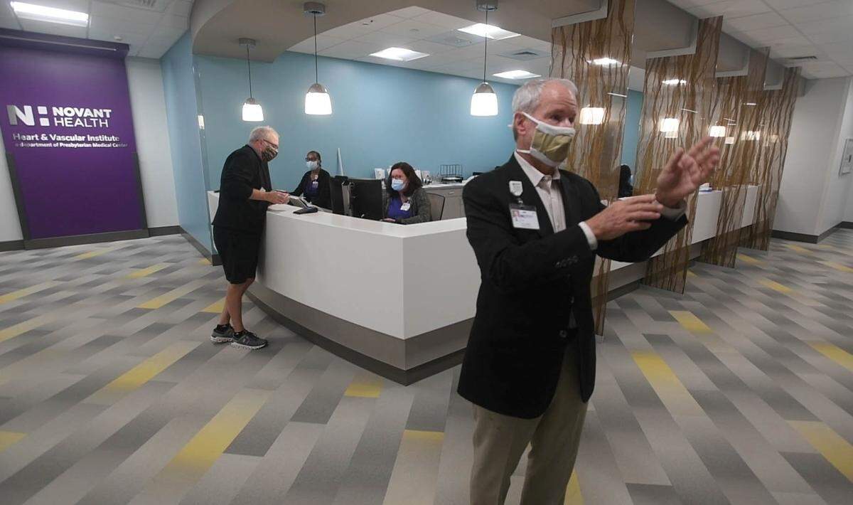 Novant Health cardiologist Dr. Gary Niess shows off the new facilities at the new heart and cancer center on the corner of Fourth Street and Queens Road.