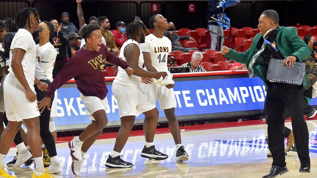 West Charlotte takes to the court and celebrate after their defeat of Fayetteville 71st. The West Charlotte Lions and the Fayetteville Seventy-First Falcons met in the NCHSAA Boys Basketball 3A Championship Game in Raleigh, N.C. on March 12, 2022.