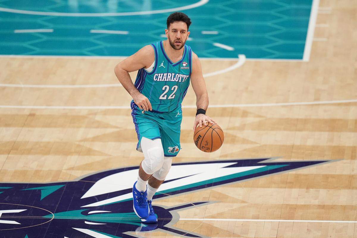 Feb 10, 2024; Charlotte, North Carolina, USA; Charlotte Hornets guard Vasilije Micic (22) brings the ball up court during the second quarter against the Memphis Grizzlies at Spectrum Center.