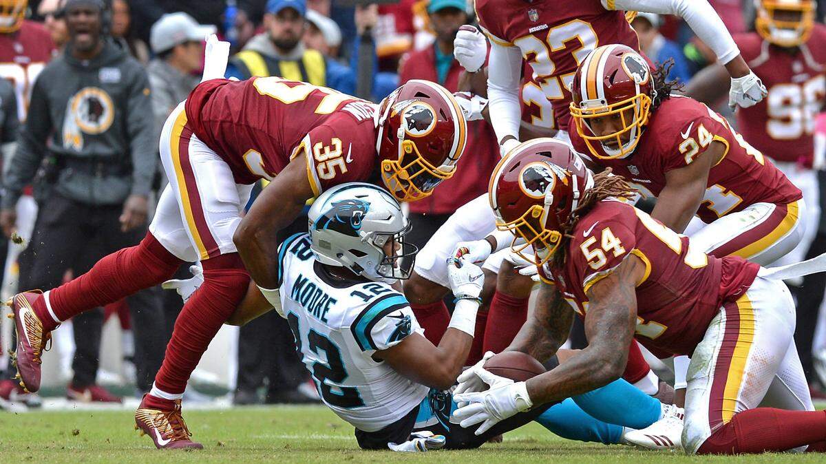 Washington Redskins linebacker Mason Foster, right, recovers a fumble by Carolina Panthers wide receiver DJ Moore during the first half at FedEx Field in Landover, Md. on Sunday. Moore lost two fumbles in a 23-17 Panthers loss.