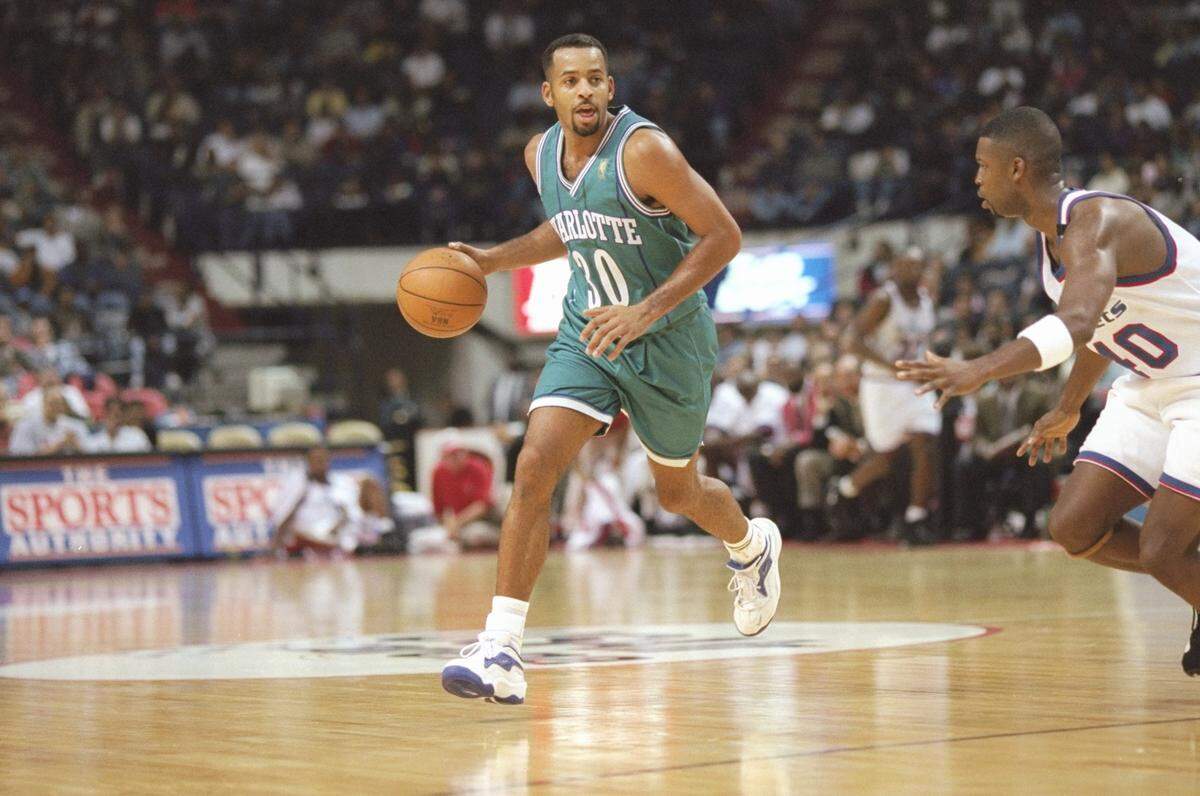 Guard Dell Curry of the Charlotte Hornets dribbles the ball down the court during a game against the Washington Bullets on Nov. 8, 1996, at the US Air Arena in Landover, Maryland. The Hornets won the game 102-87.