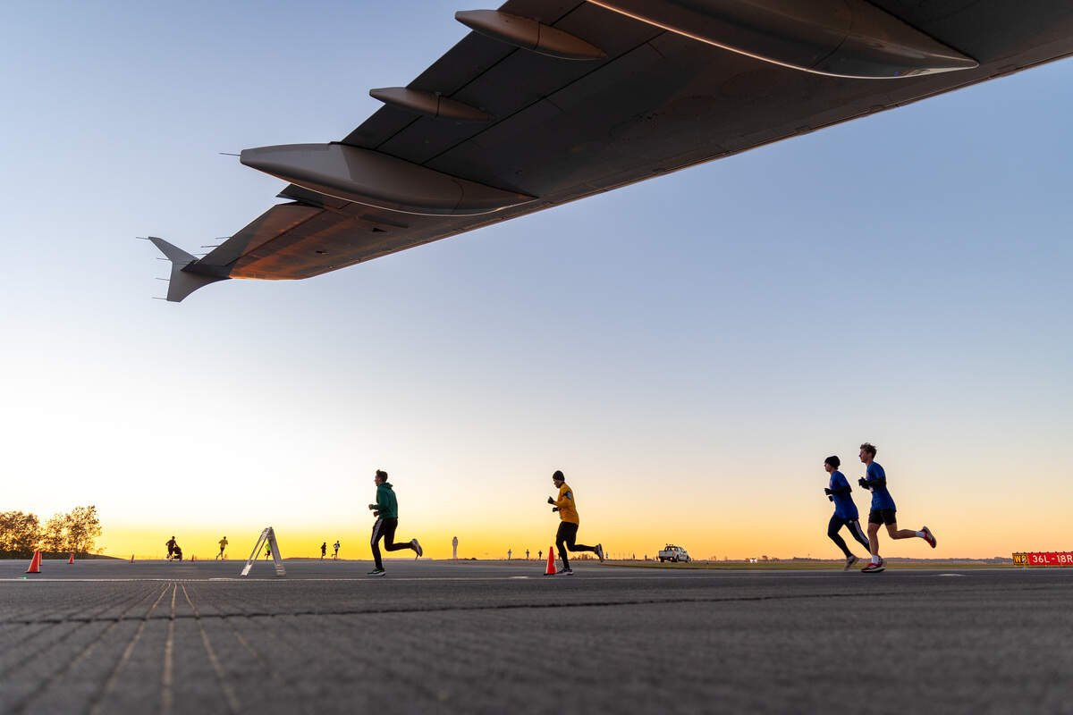Runners cruise along the runway during a past Runway 5K event at Charlotte Douglas International Airport.