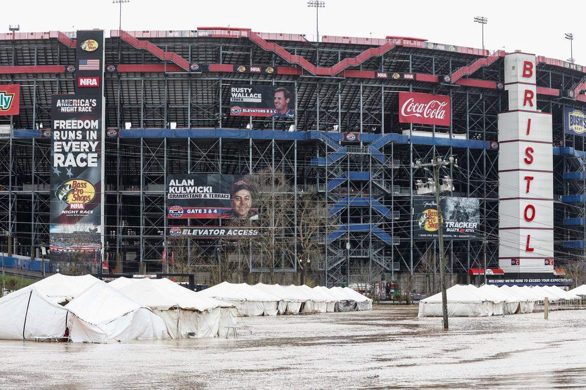 Damaged vendor tents sit in a flooded area near Bristol Motor Speedway as races for both the Truck Series and NASCAR Cup Series auto race was postponed due to inclement weather, Sunday, March 28, 2021, in Bristol, Tenn. (AP Photo/Wade Payne)